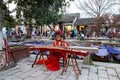 Mar 2017 -Tongli, Jiangsu, China Ã¢â¬â Girl in a traditional Chinese red dress playing a Guzheng along the canals of Tongli Royalty Free Stock Photo